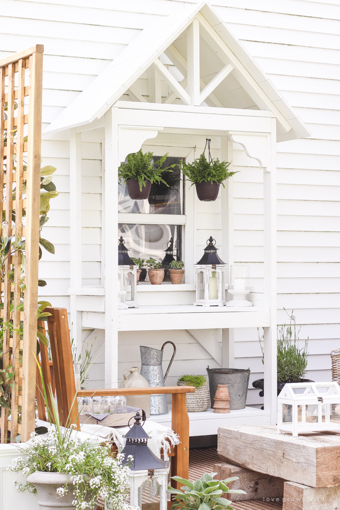 A boring, bare patio turned into a gorgeous outdoor entertaining area! See the incredible before and after of this beautiful patio makeover!