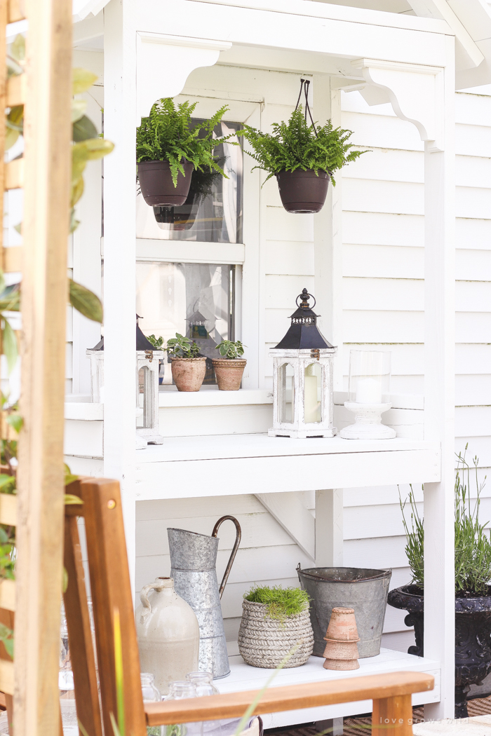 A boring, bare patio turned into a gorgeous outdoor entertaining area! See the incredible before and after of this beautiful patio makeover! 