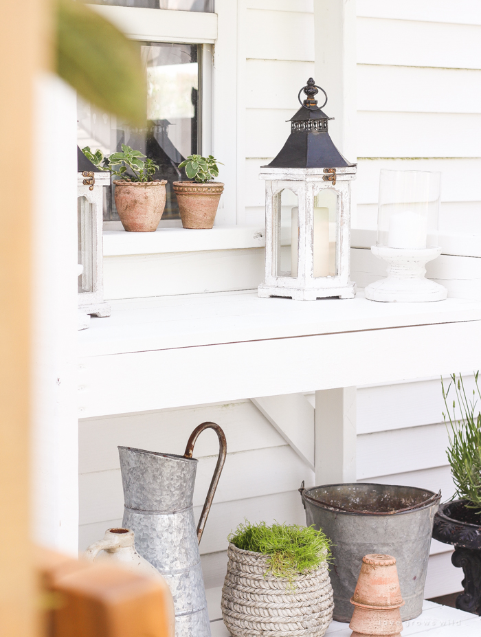 A boring, bare patio turned into a gorgeous outdoor entertaining area! See the incredible before and after of this beautiful patio makeover! 