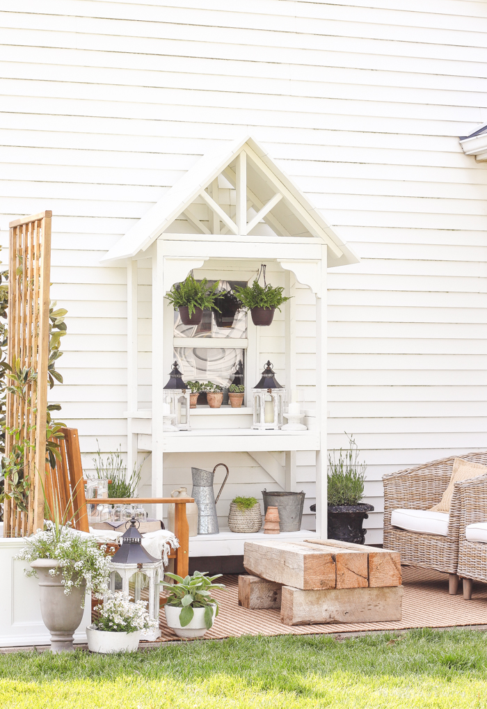 A boring, bare patio turned into a gorgeous outdoor entertaining area! See the incredible before and after of this beautiful patio makeover! 