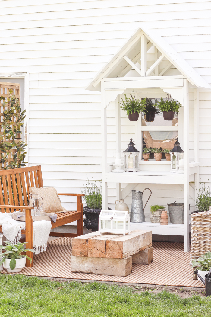 A boring, bare patio turned into a gorgeous outdoor entertaining area! See the incredible before and after of this beautiful patio makeover! 