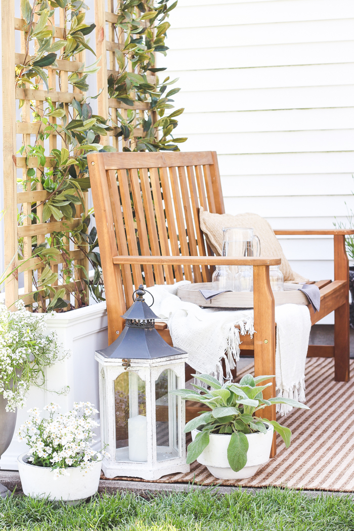 A boring, bare patio turned into a gorgeous outdoor entertaining area! See the incredible before and after of this beautiful patio makeover!