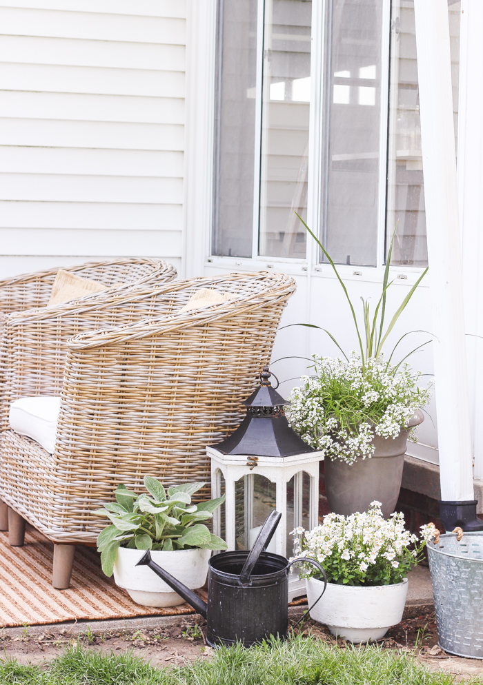 A boring, bare patio turned into a gorgeous outdoor entertaining area! See the incredible before and after of this beautiful patio makeover! 