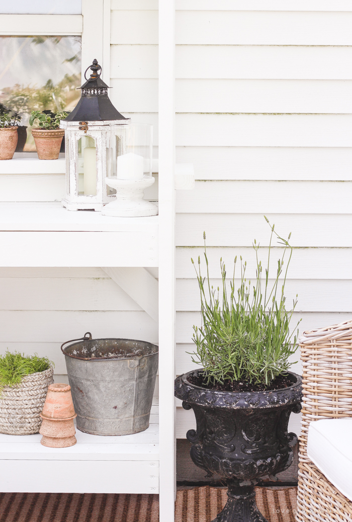 A boring, bare patio turned into a gorgeous outdoor entertaining area! See the incredible before and after of this beautiful patio makeover! 