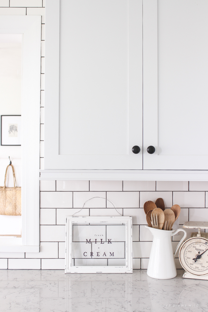 Follow along the makeover of this beautiful farmhouse kitchen! In this post, Liz shares all the finishing touches she picked for lighting, faucets, furniture, and more!