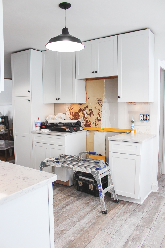 Follow along the makeover of this beautiful farmhouse kitchen! In this post, Liz shares all the finishing touches she picked for lighting, faucets, furniture, and more!