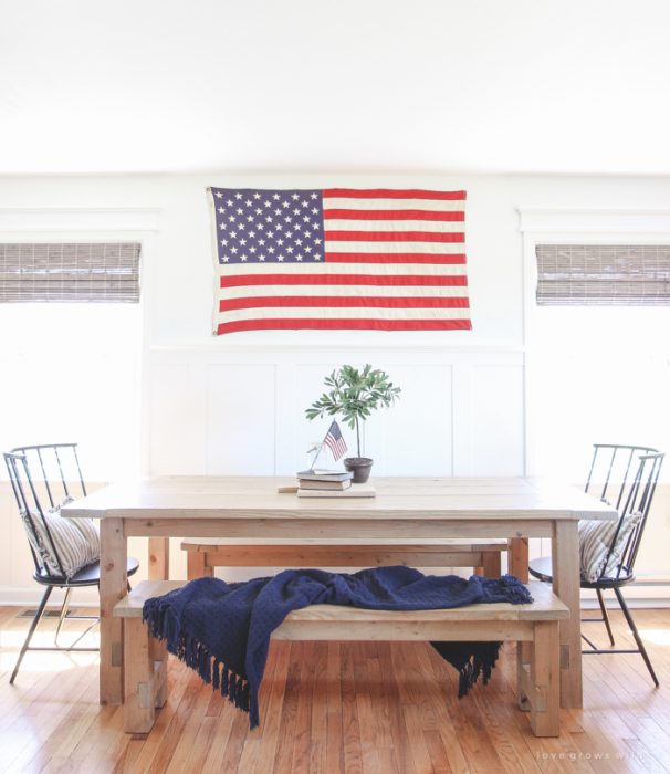 Simple touches of red, white and blue give this farmhouse dining room the perfect patriotic feel.