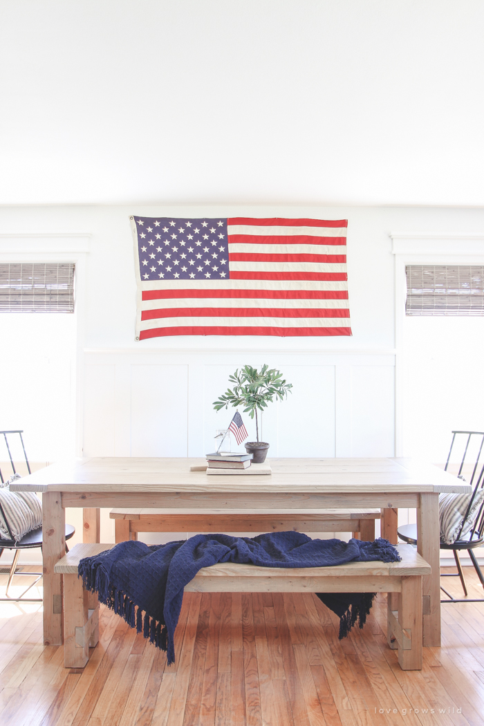 Simple touches of red, white and blue give this farmhouse dining room the perfect patriotic feel. 
