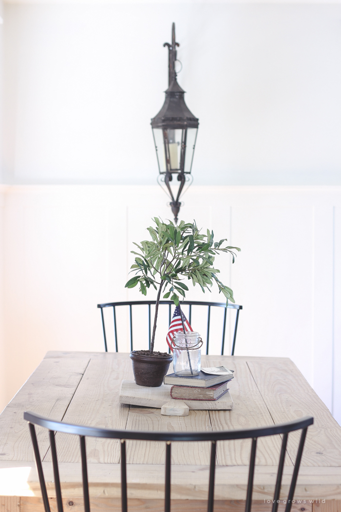 Simple touches of red, white and blue give this farmhouse dining room the perfect patriotic feel. 