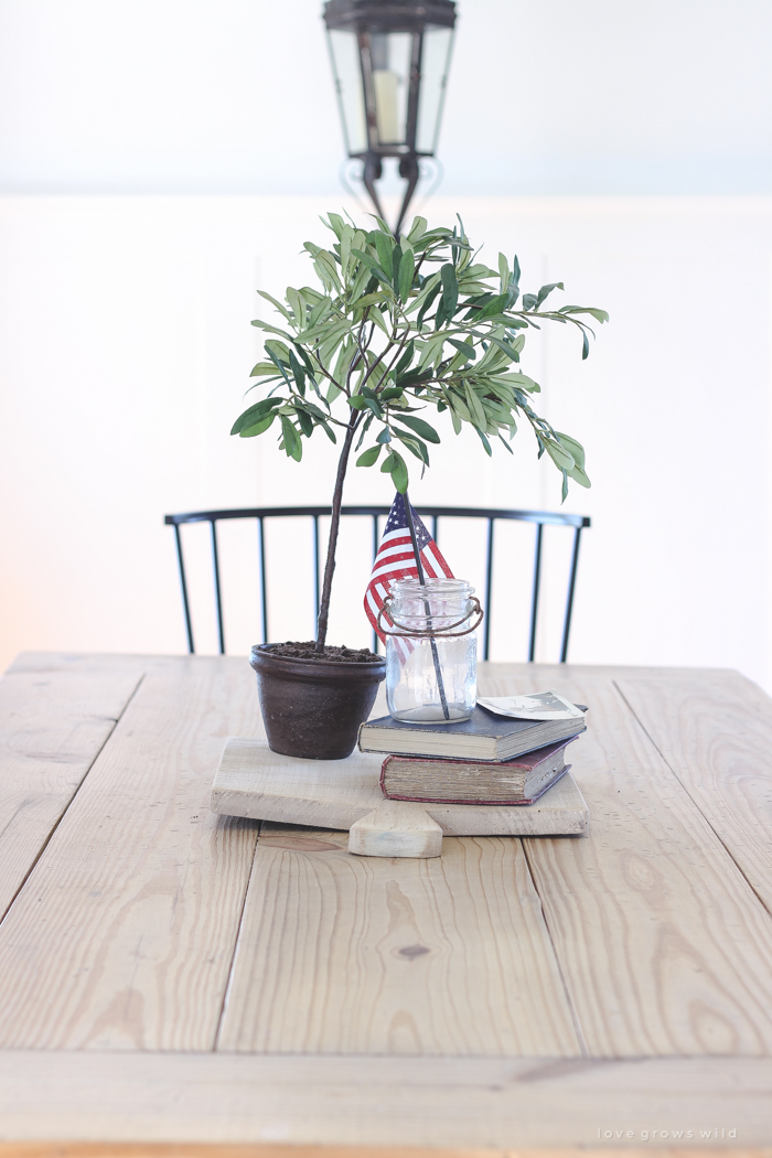 Simple touches of red, white and blue give this farmhouse dining room the perfect patriotic feel. 