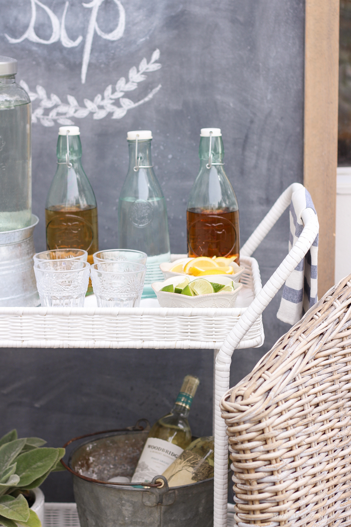 This gorgeous patio is perfect for summer entertaining! Learn how to create a simple, yet stunning outdoor bar cart for your next party!