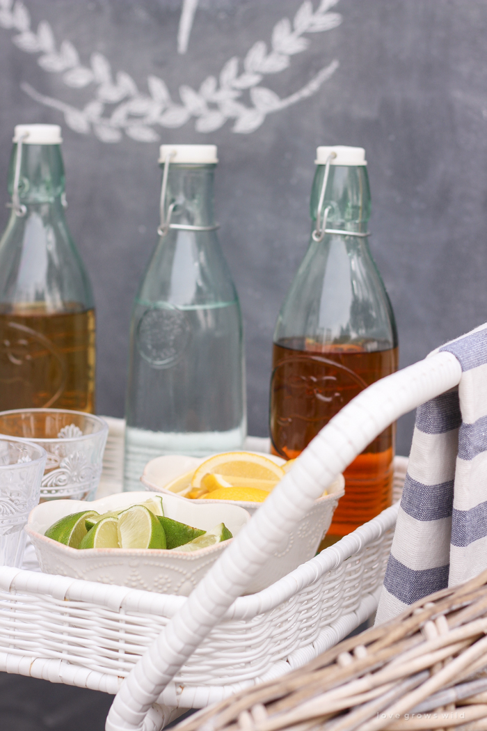 This gorgeous patio is perfect for summer entertaining! Learn how to create a simple, yet stunning outdoor bar cart for your next party!