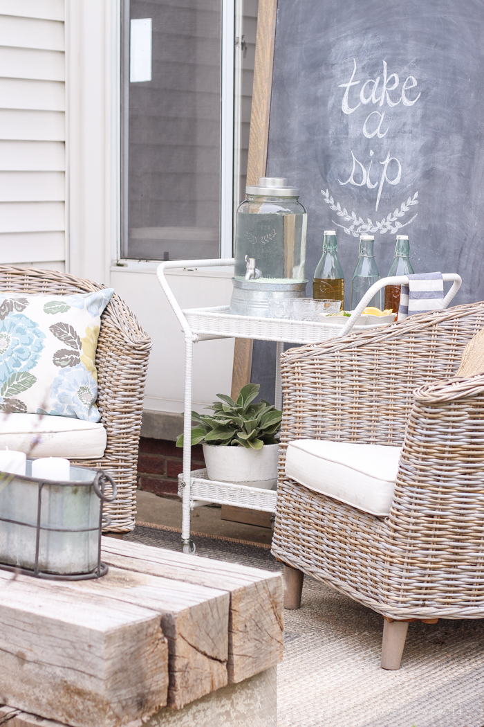 This gorgeous patio is perfect for summer entertaining! Learn how to create a simple, yet stunning outdoor bar cart for your next party!