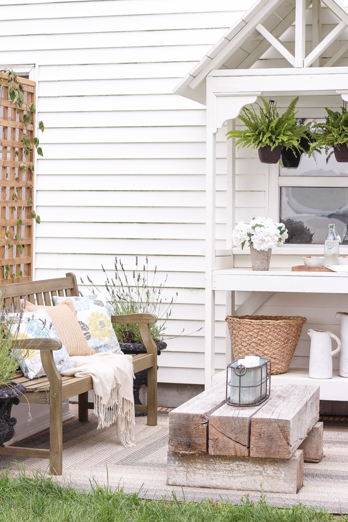 This gorgeous patio is perfect for summer entertaining! Learn how to create a simple, yet stunning outdoor bar cart for your next party!