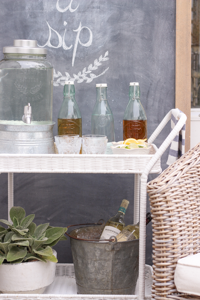 This gorgeous patio is perfect for summer entertaining! Learn how to create a simple, yet stunning outdoor bar cart for your next party!