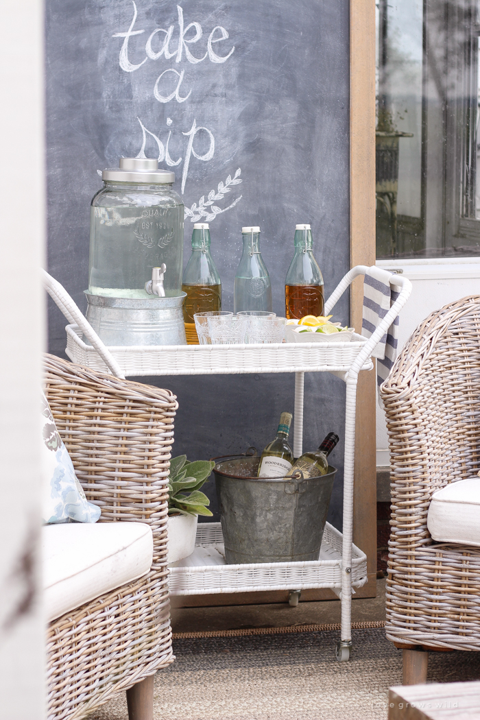 This gorgeous patio is perfect for summer entertaining! Learn how to create a simple, yet stunning outdoor bar cart for your next party!