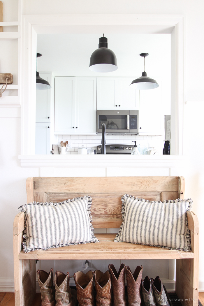 Step inside this beautiful Indiana farmhouse entryway decorated with a mix of timeworn antiques and unique DIY projects!