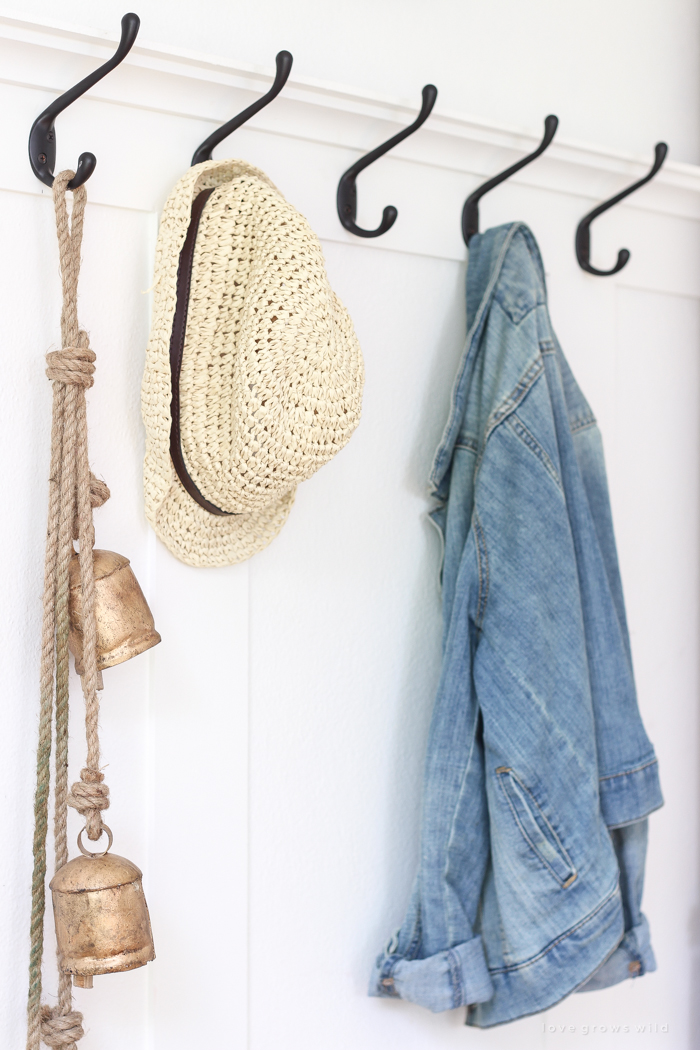 Step inside this beautiful Indiana farmhouse entryway decorated with a mix of timeworn antiques and unique DIY projects!