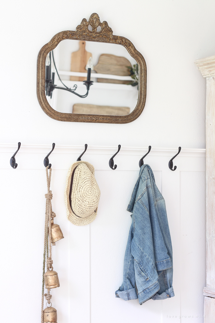 Step inside this beautiful Indiana farmhouse entryway decorated with a mix of timeworn antiques and unique DIY projects!