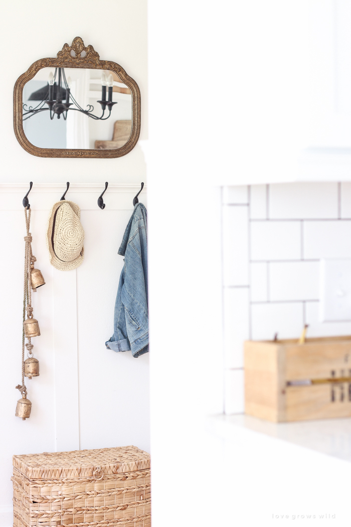 Step inside this beautiful Indiana farmhouse entryway decorated with a mix of timeworn antiques and unique DIY projects!