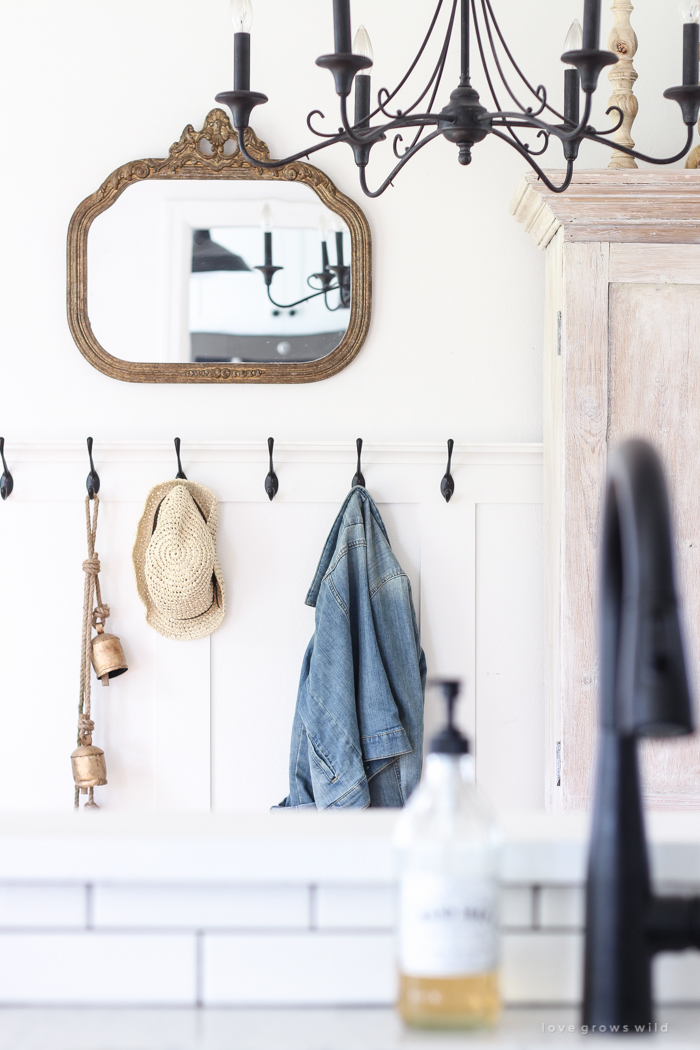 Step inside this beautiful Indiana farmhouse entryway decorated with a mix of timeworn antiques and unique DIY projects!