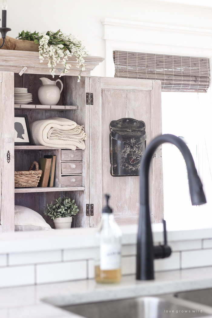 Step inside this beautiful Indiana farmhouse entryway decorated with a mix of timeworn antiques and unique DIY projects!