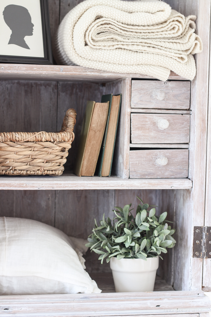 Step inside this beautiful Indiana farmhouse entryway decorated with a mix of timeworn antiques and unique DIY projects!