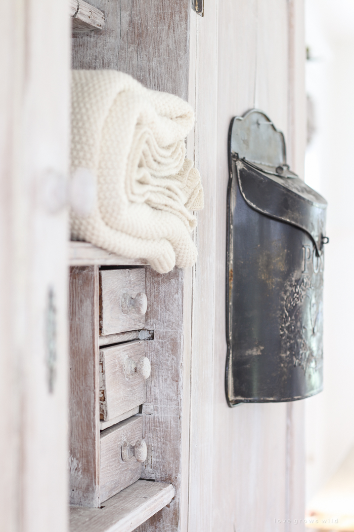 Step inside this beautiful Indiana farmhouse entryway decorated with a mix of timeworn antiques and unique DIY projects!