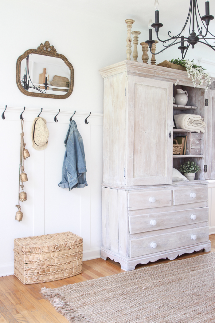 Step inside this beautiful Indiana farmhouse entryway decorated with a mix of timeworn antiques and unique DIY projects!