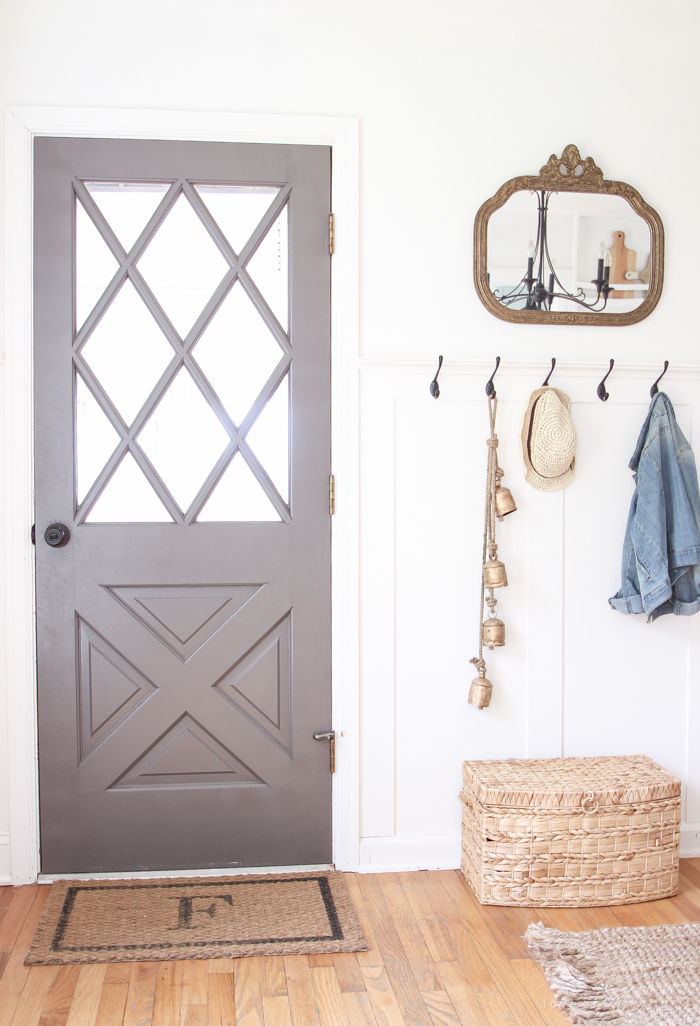 Step inside this beautiful Indiana farmhouse entryway decorated with a mix of timeworn antiques and unique DIY projects!