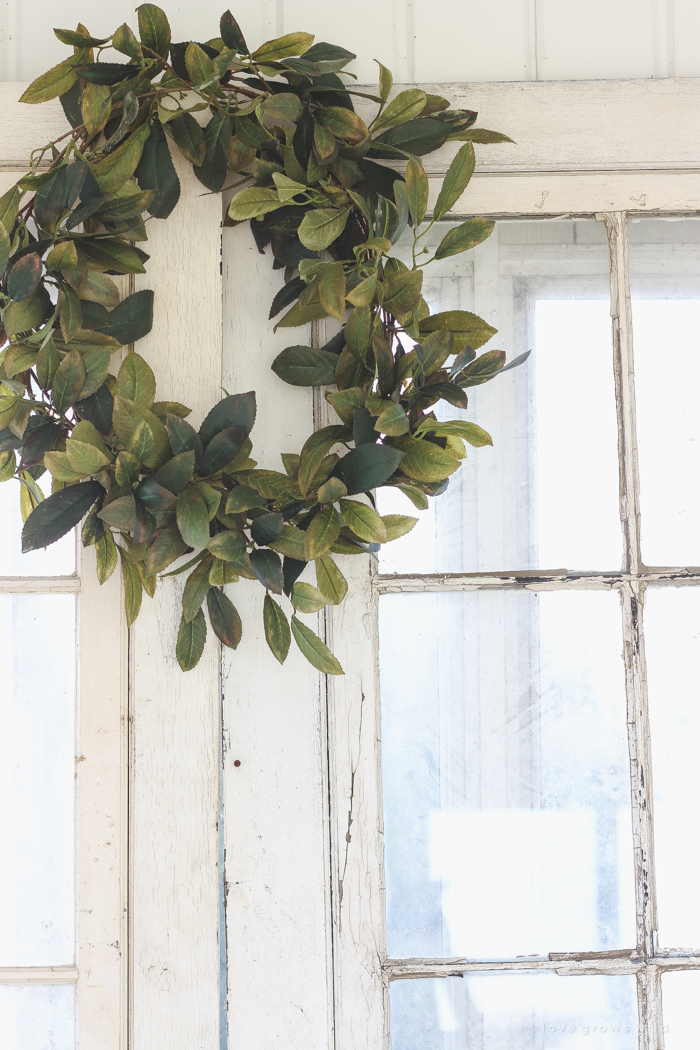 A beautiful farmhouse front porch decorated with simple touches of fall!