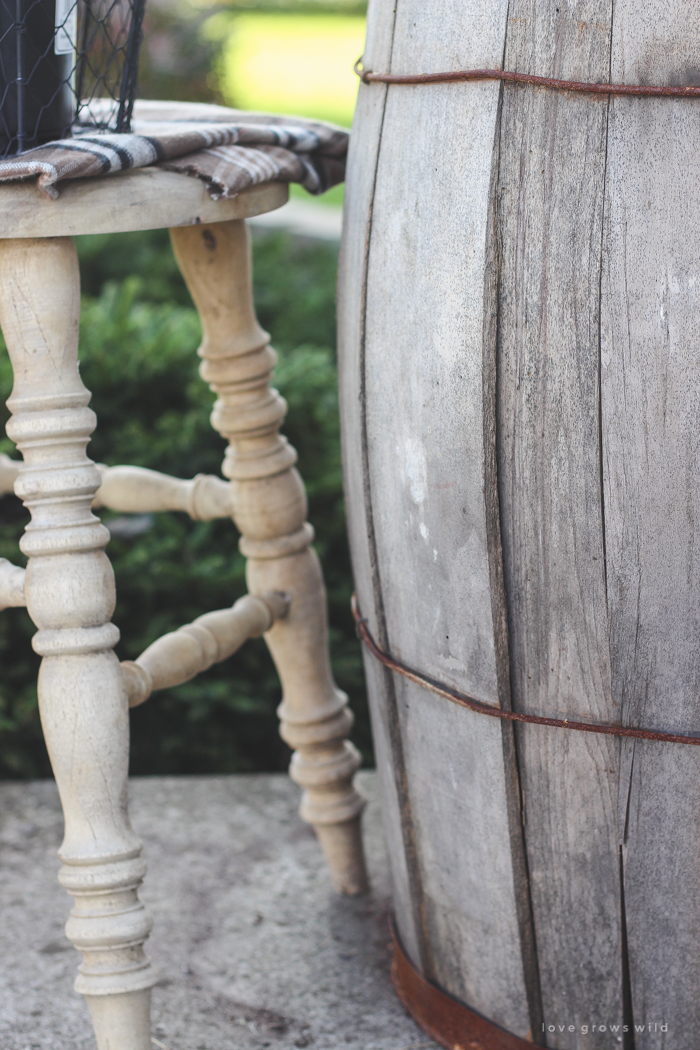 A beautiful farmhouse front porch decorated with simple touches of fall!