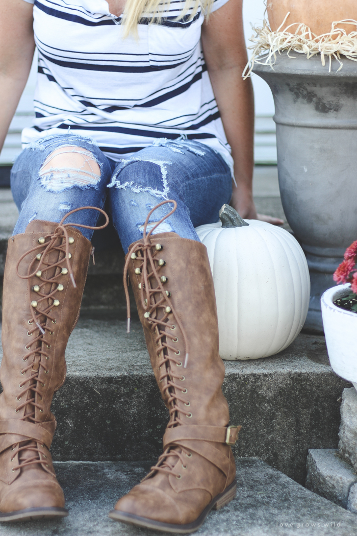 A beautiful farmhouse front porch decorated with simple touches of fall!