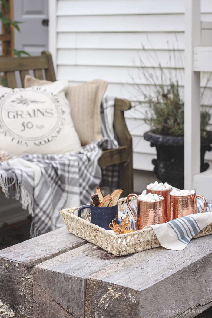 A small patio is transformed into a cozy seating area for fall. 