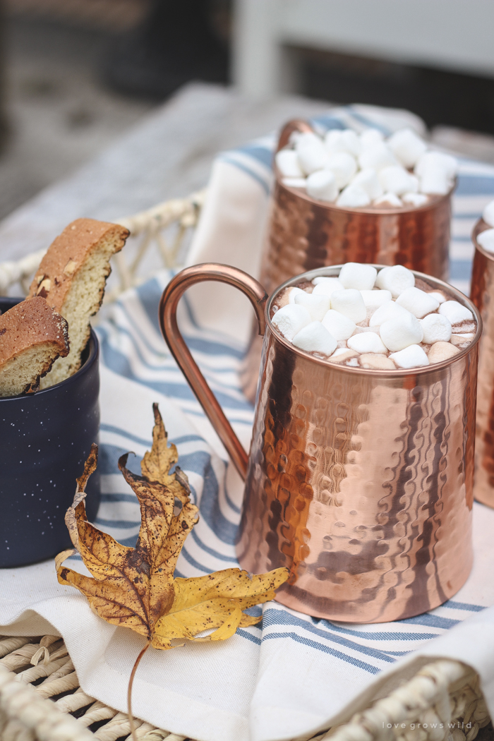 A small patio is transformed into a cozy seating area for fall. 