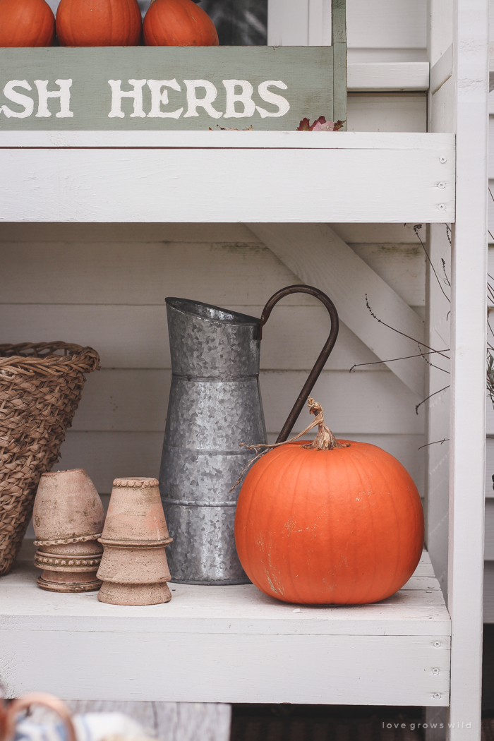 A small patio is transformed into a cozy seating area for fall. 