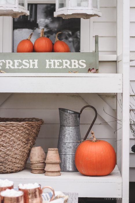 A small patio is transformed into a cozy seating area for fall.