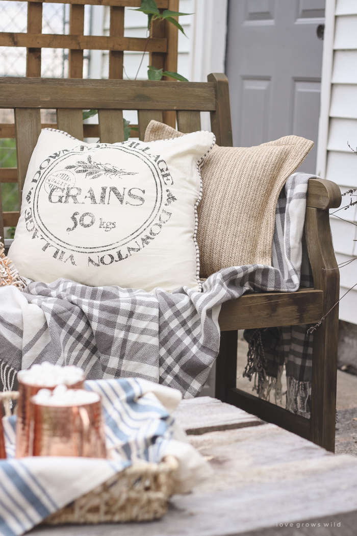 A small patio is transformed into a cozy seating area for fall.