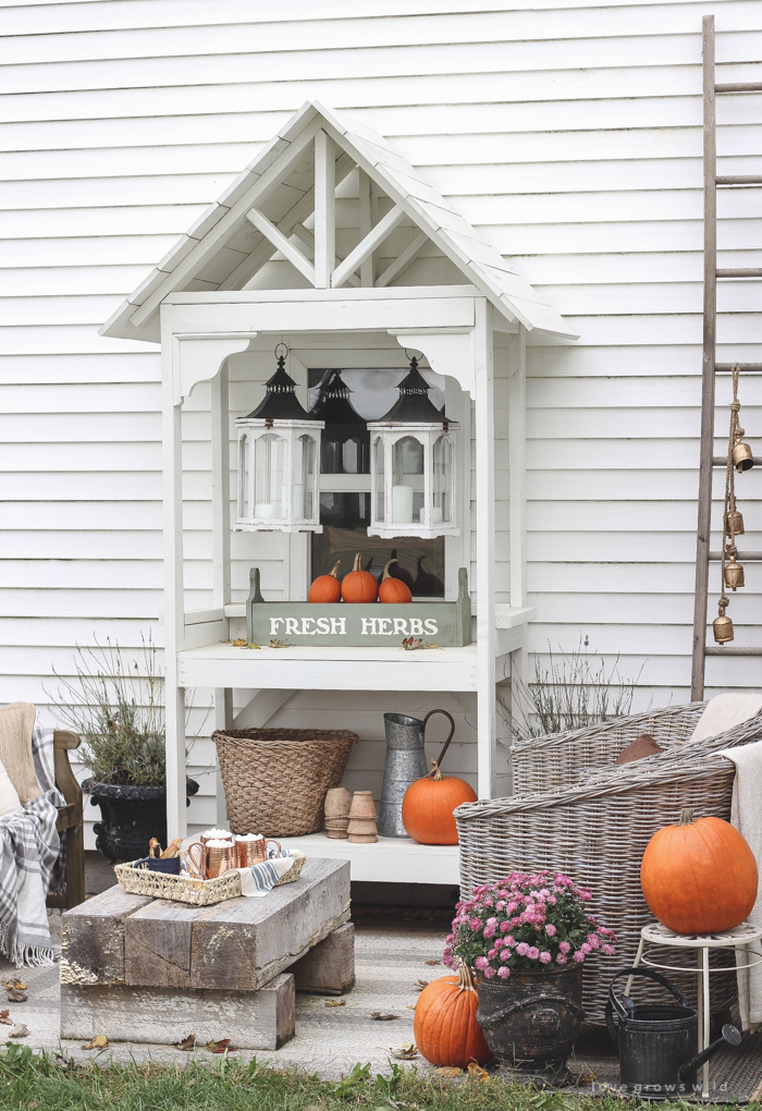 A small patio is transformed into a cozy seating area for fall. 