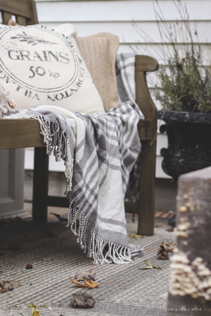 A small patio is transformed into a cozy seating area for fall. 