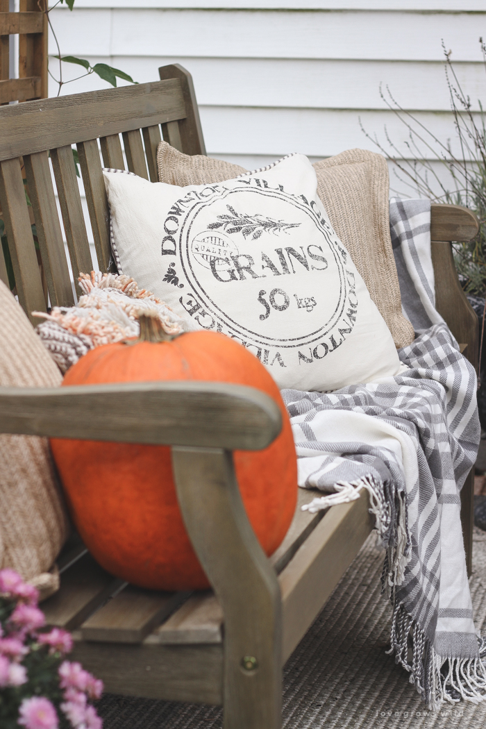 A small patio is transformed into a cozy seating area for fall. 