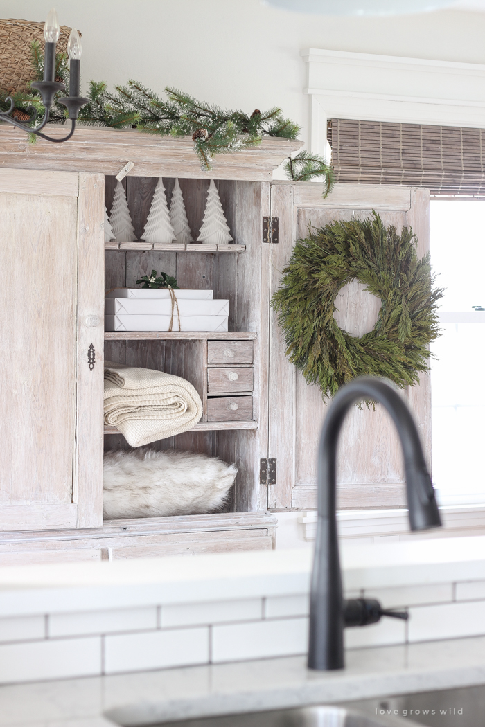 A beautiful farmhouse entryway decorated for the holidays!