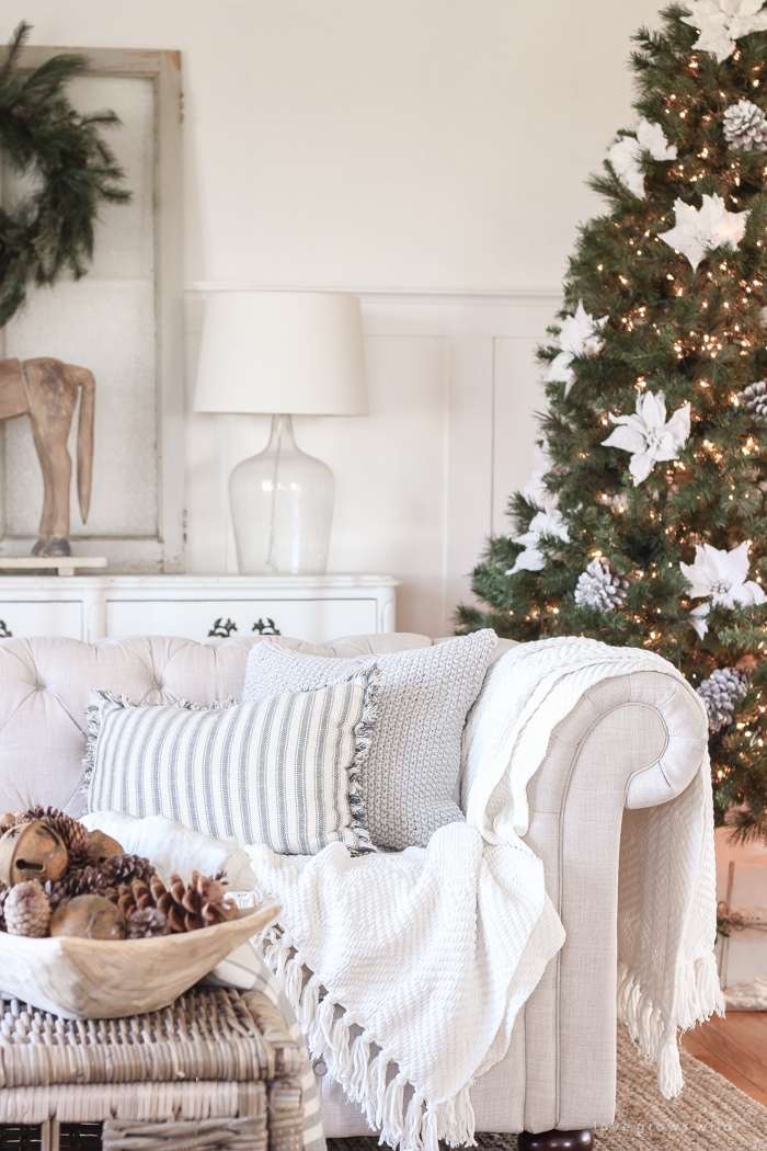 A beautiful farmhouse living room decorated for the holidays!