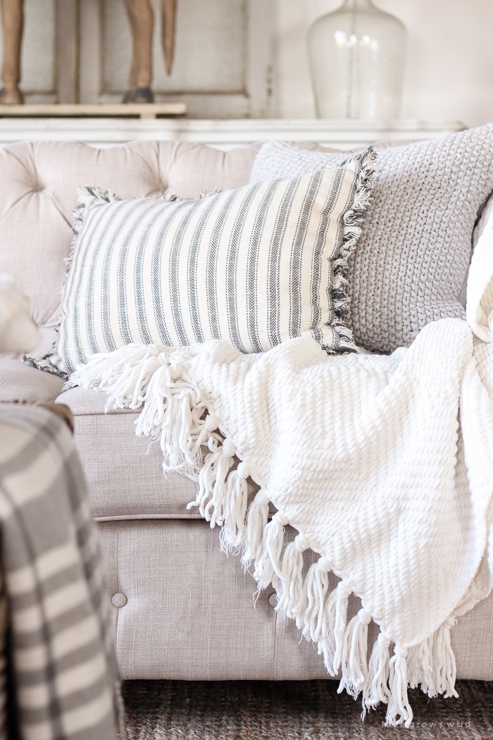 A beautiful farmhouse living room decorated for the holidays!