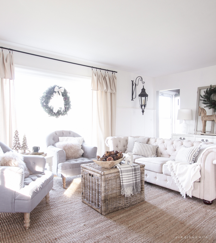 A beautiful farmhouse living room decorated for the holidays!