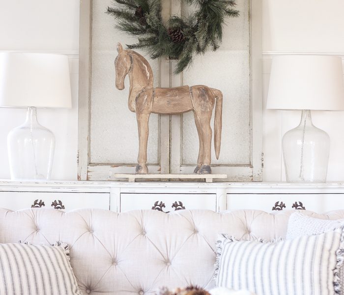 A beautiful farmhouse living room decorated for the holidays!