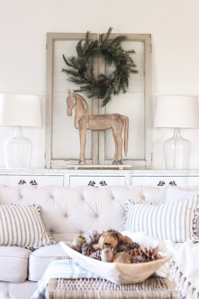 A beautiful farmhouse living room decorated for the holidays!