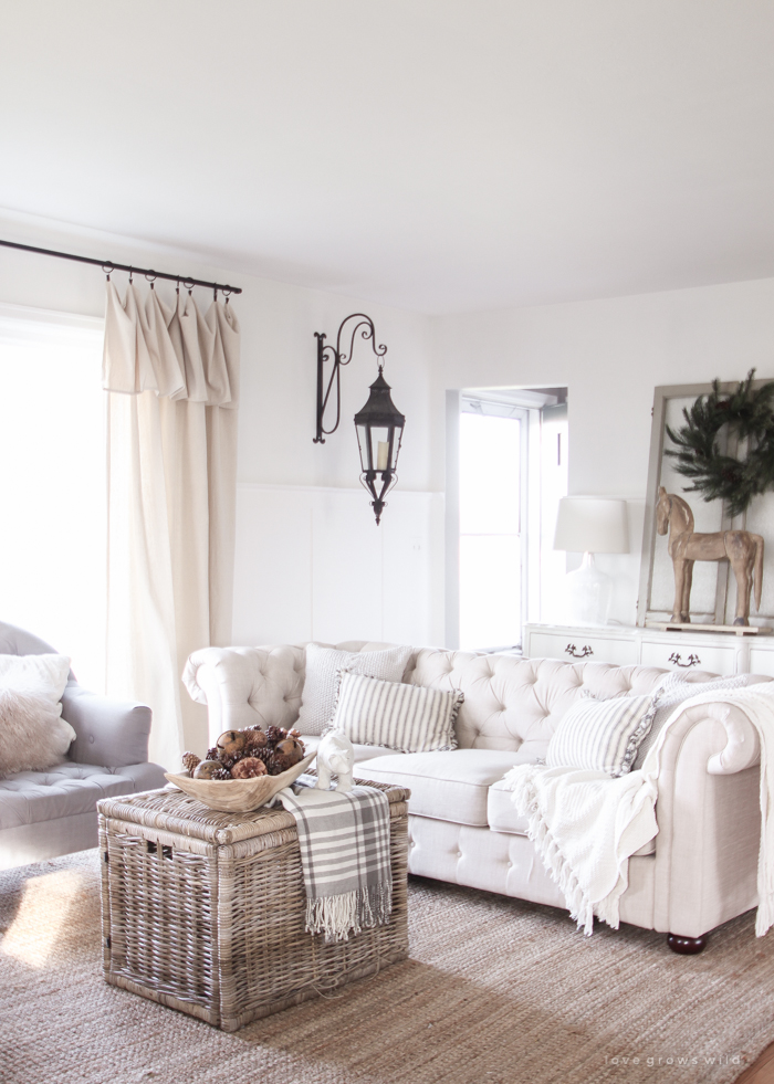 A beautiful farmhouse living room decorated for the holidays!