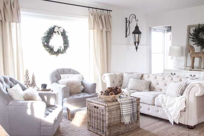 A beautiful farmhouse living room decorated for the holidays!