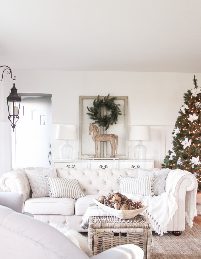 A beautiful farmhouse living room decorated for the holidays!